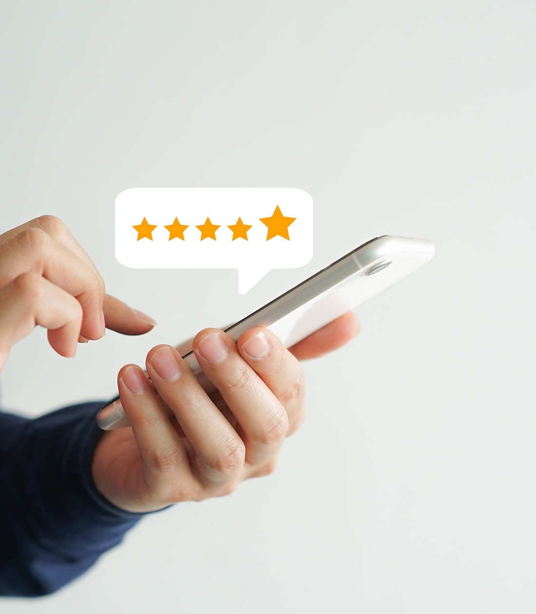 Person holding smartphone displaying five-star rating, symbolizing positive feedback for safety consulting services.